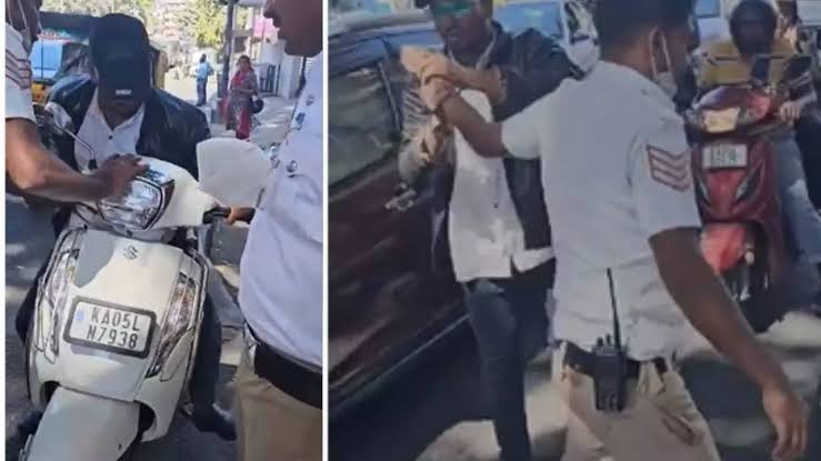 Man caught without helmet bites traffic police